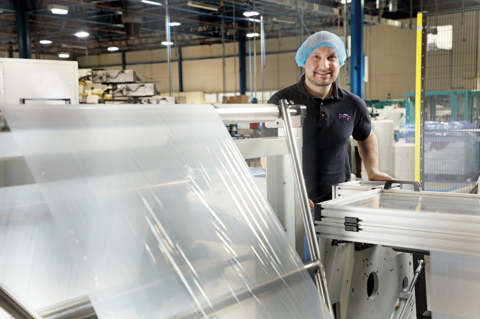 Lee Wilkinson of PFF Group with the new folding machines.JPG