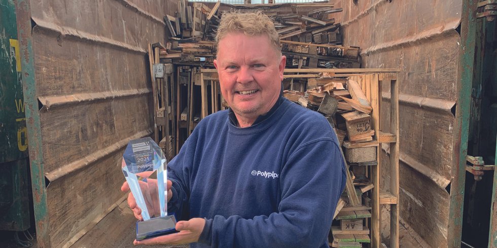 Polypipe Building Services recycling operative Paul Knight with the Recycling Award from Wolseley and an image of the PBS recycling crates at Wolseley.