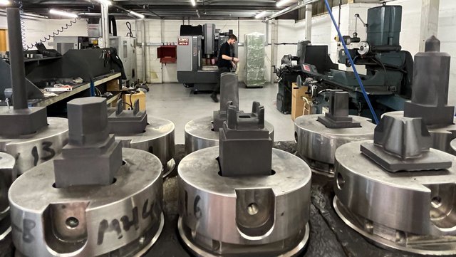 Electrodes foreground with machining centre background.jpg
